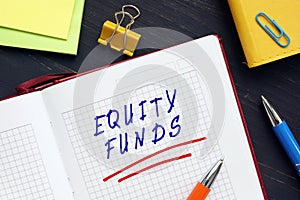 Financial concept about EQUITY FUNDS with phrase on the sheet. AnÃÂ equity fundÃÂ is aÃÂ mutual fundÃÂ that invests principally in photo